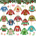 Collection of 15 diamond painting keychain kits shaped like ugly Christmas sweaters, displayed against a festive evergreen garland background.