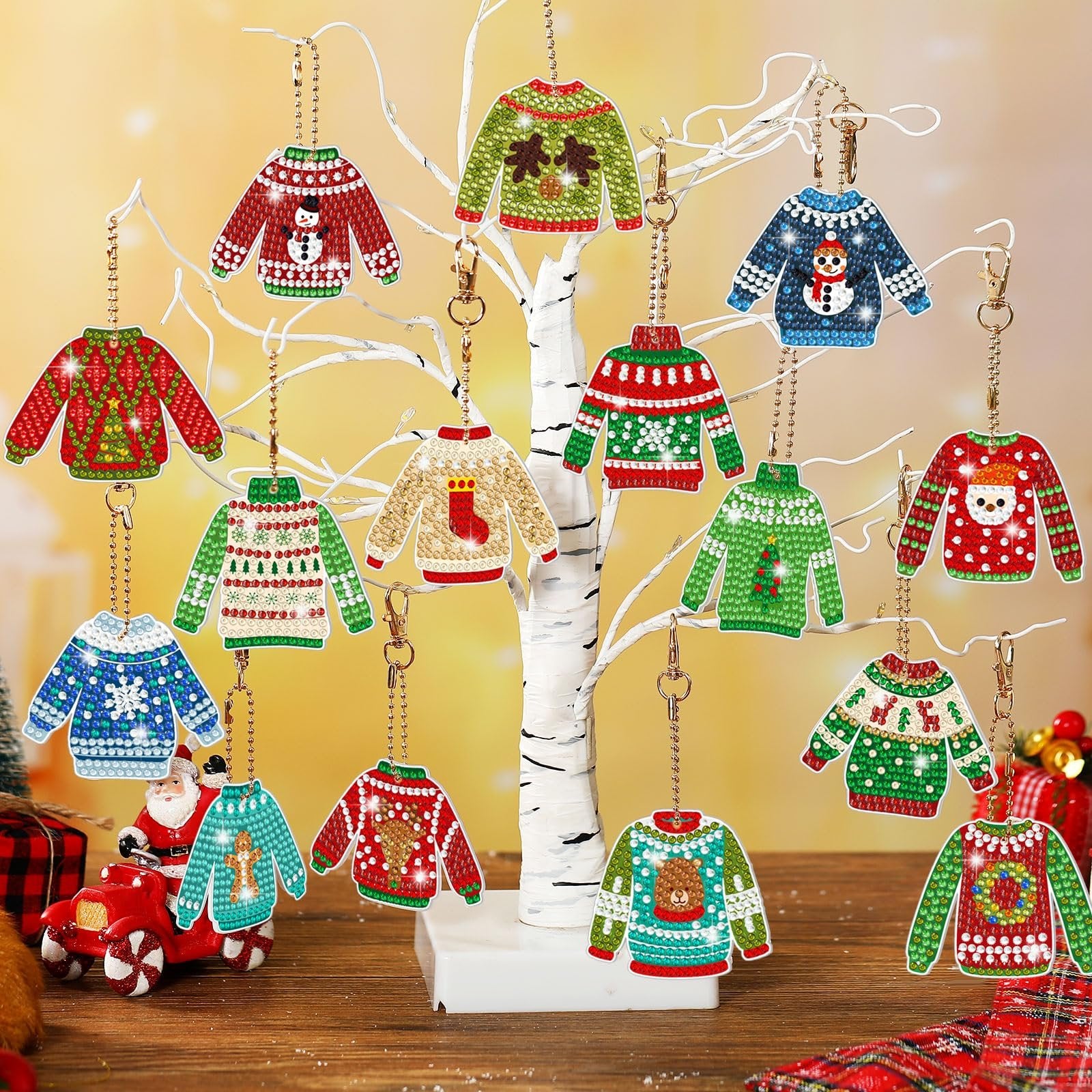 Christmas ugly sweater diamond painting keychain ornaments displayed on a white tree branch, featuring various festive designs like snowmen, reindeer, and Santa.