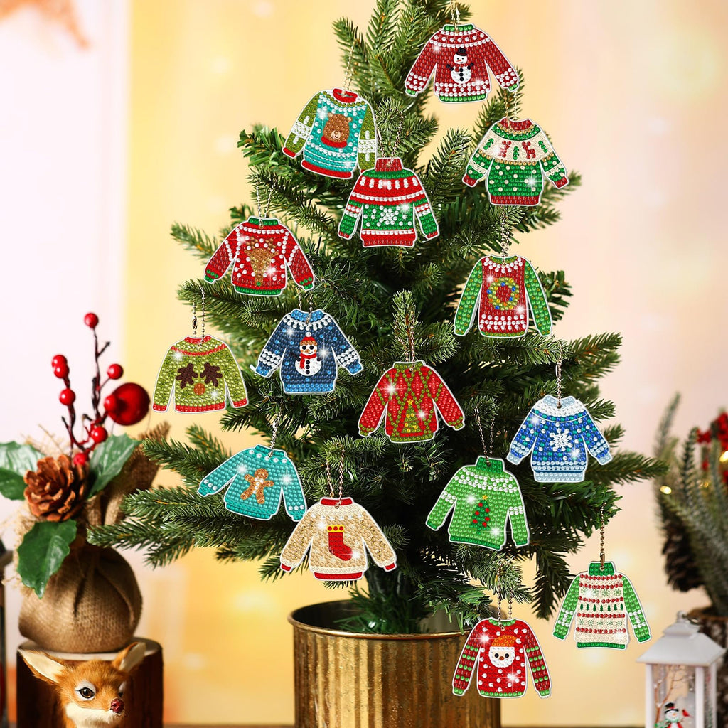 Christmas diamond painting keychain kits shaped like ugly sweaters hanging on a decorated tree