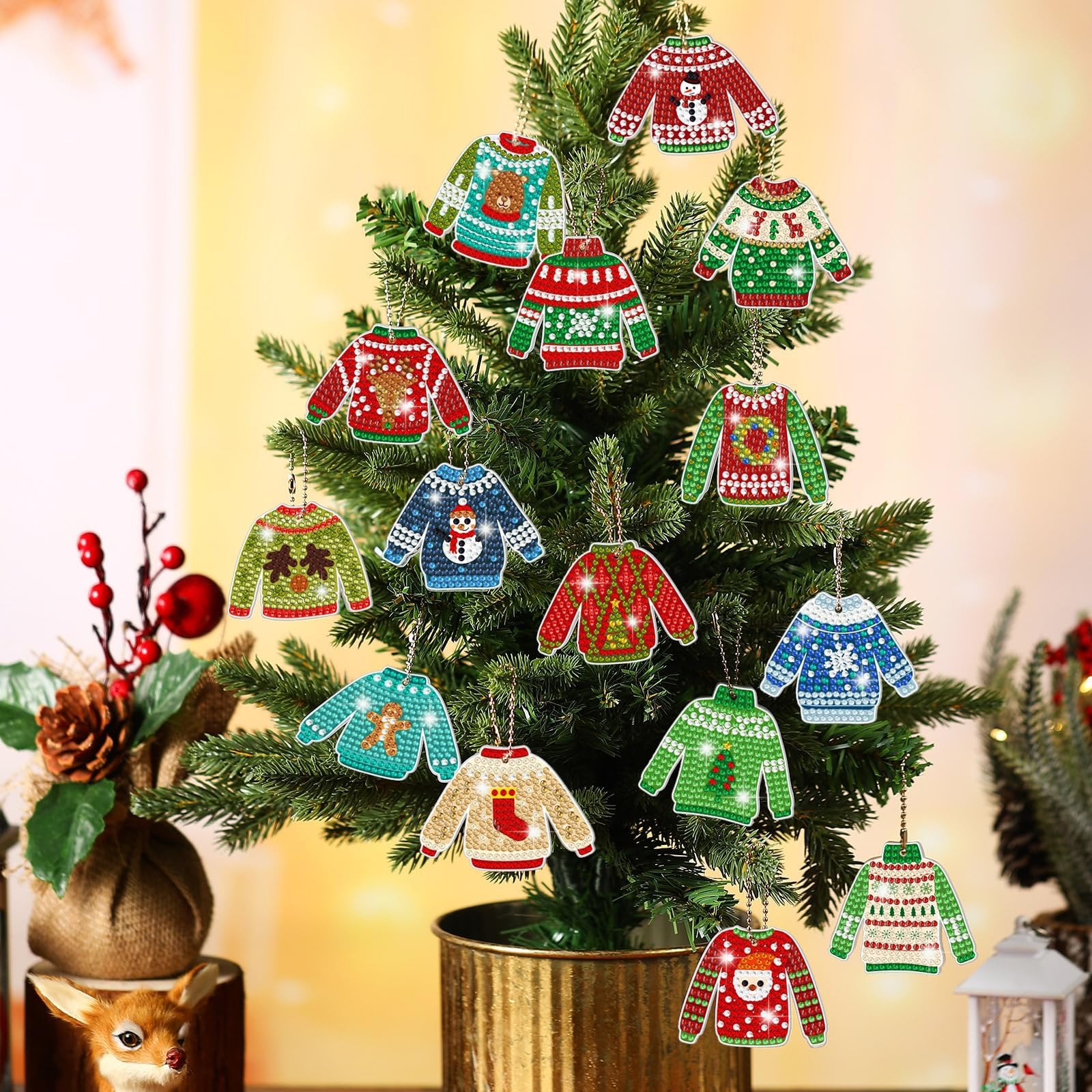 Christmas diamond painting keychain kits shaped like ugly sweaters hanging on a decorated tree