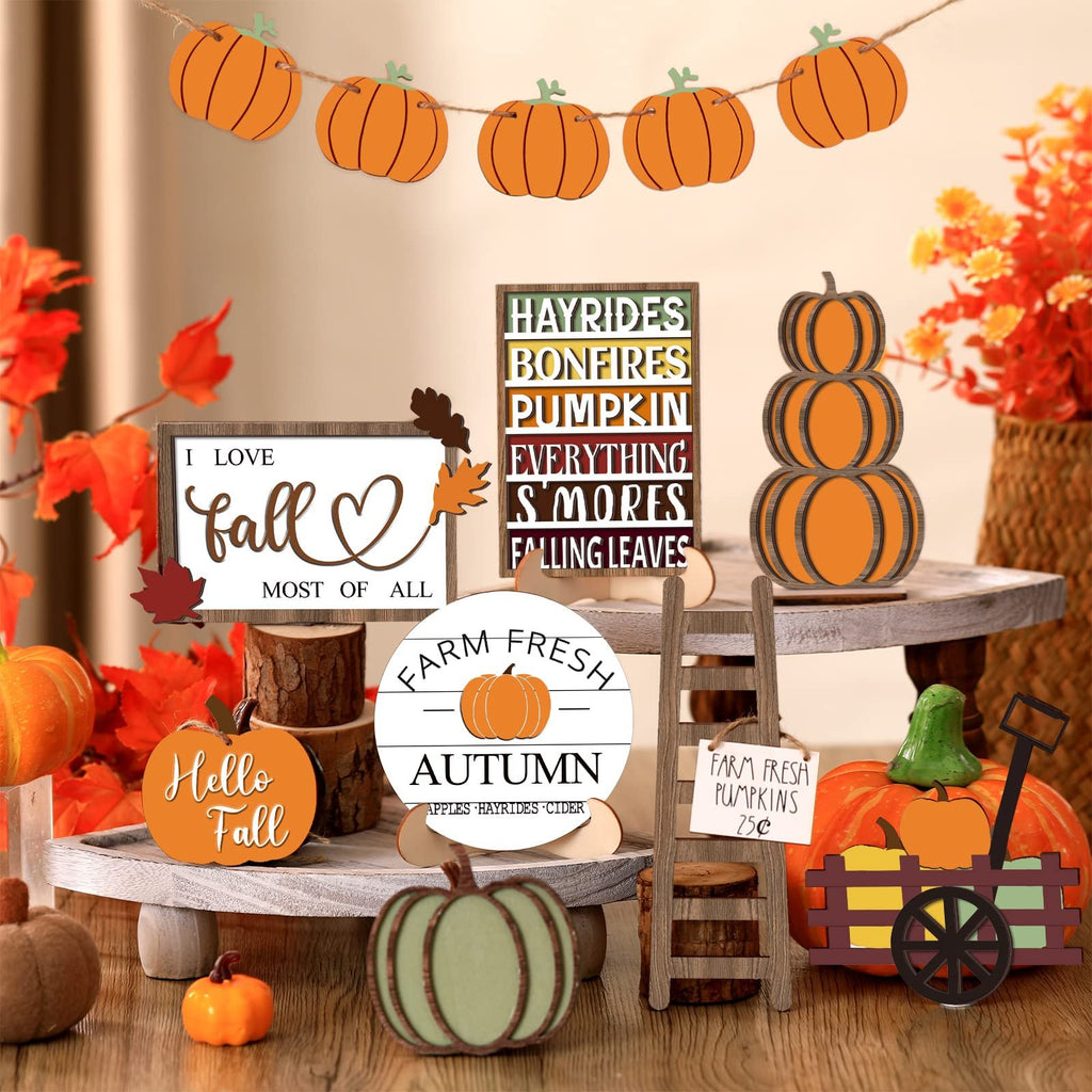 Thanksgiving tiered tray decor set with pumpkins, signs, and fall leaves. Includes a pumpkin garland, stacked pumpkins, and various signs with fall themes.