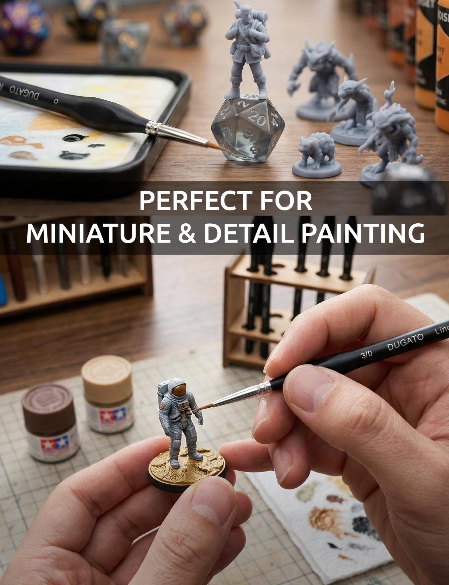 Close-up of a hand painting a miniature figure with a fine detail brush, showing paint bottles and dice in the background.