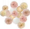 Set of 15 paper decorations including pom poms and lanterns in navy blue, white, and gold, suspended by strings.