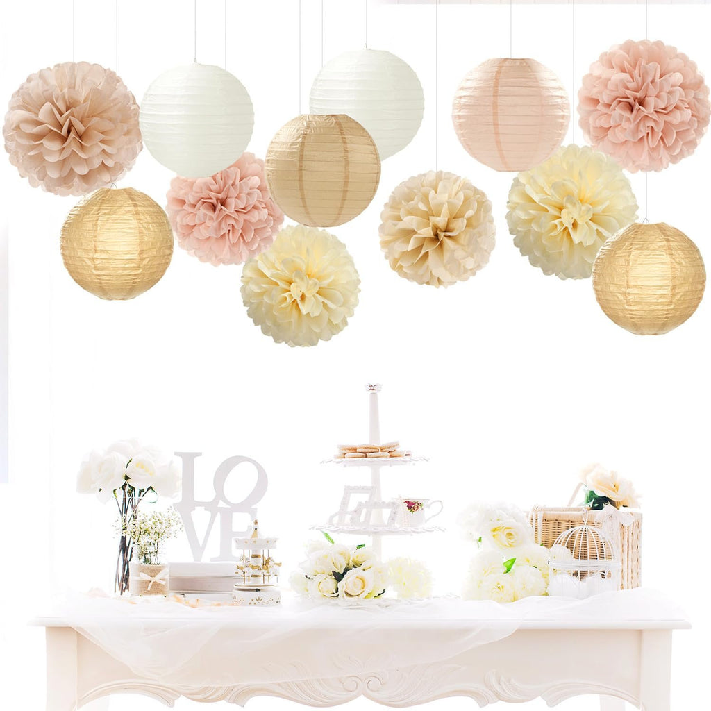 Party decoration kit with hanging paper pom poms and lanterns above a table with flowers and a tiered stand.