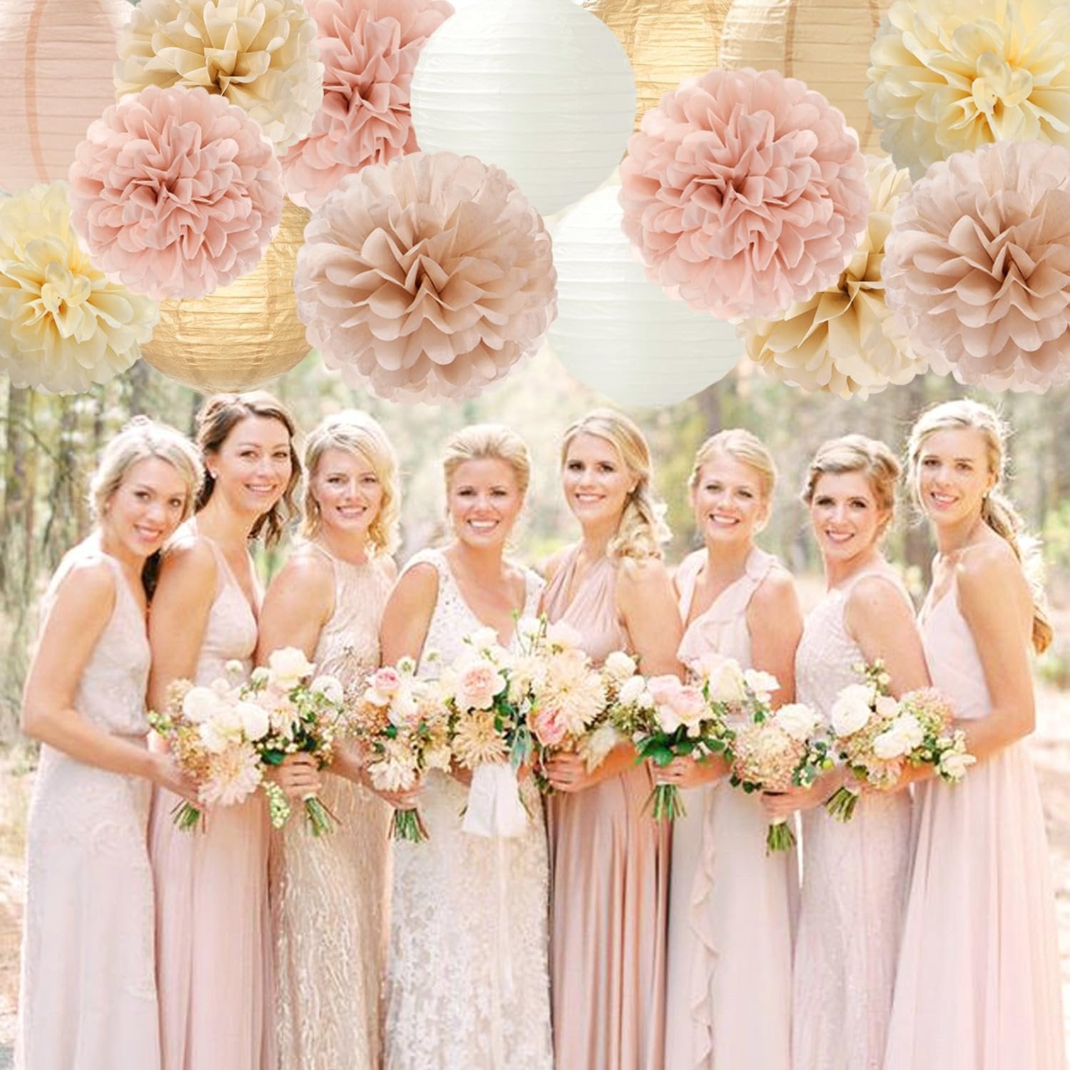 Bridal party holding bouquets with paper flowers and lanterns in background