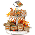 Thanksgiving tiered tray decor set with wooden gnome, pumpkins, pie slices, and autumn leaves.