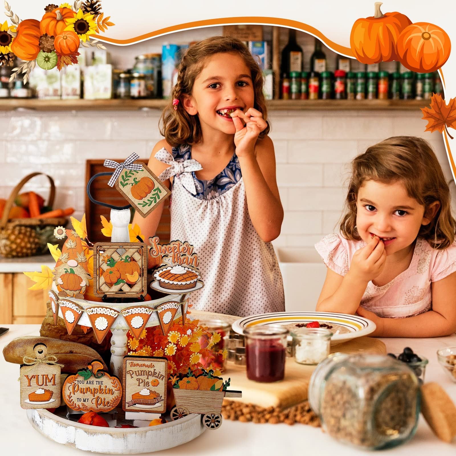Two young girls smiling and eating at a kitchen counter with a Thanksgiving tiered tray decor set.