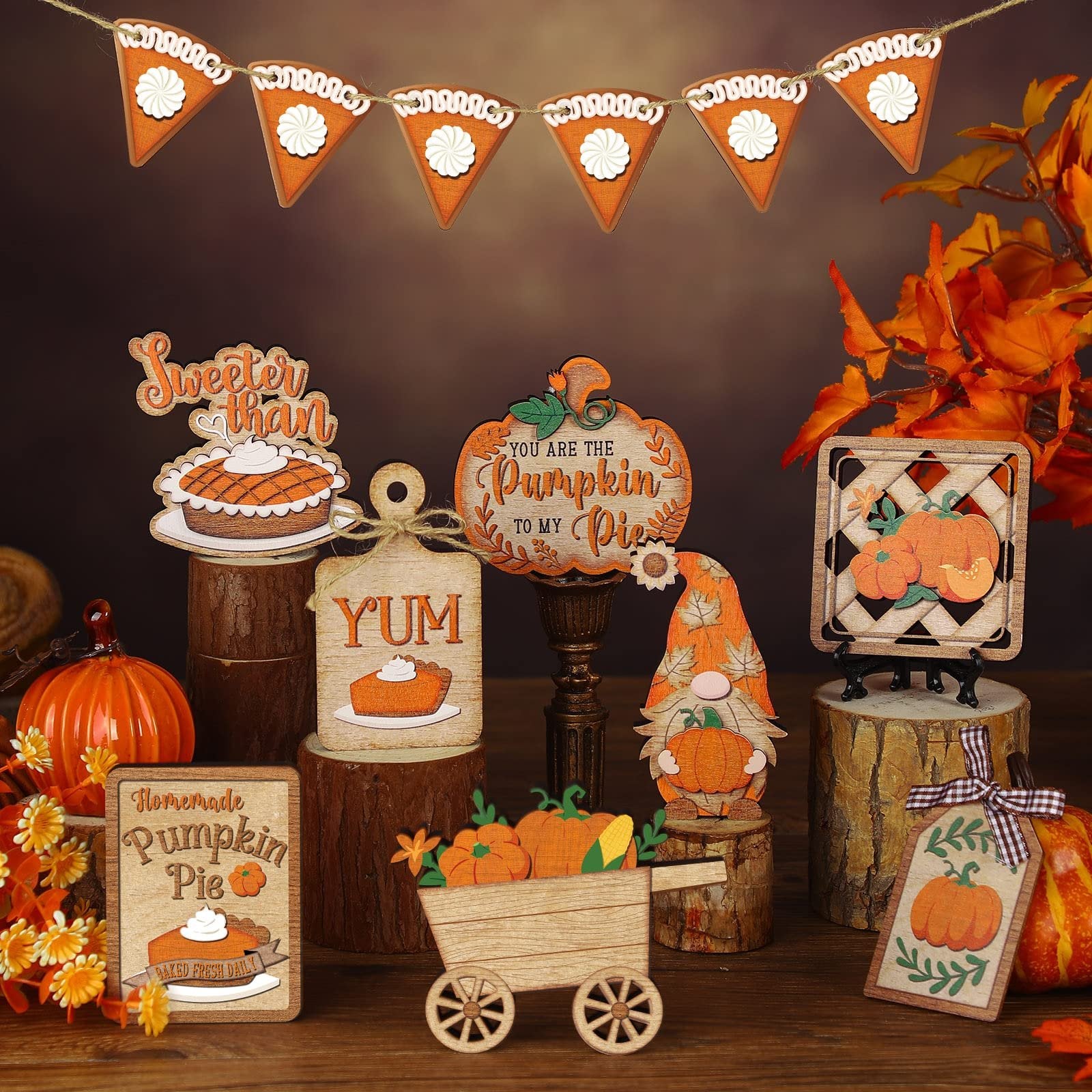 Thanksgiving tiered tray decor set with wood pumpkins, pies, and a gnome on a wooden surface.