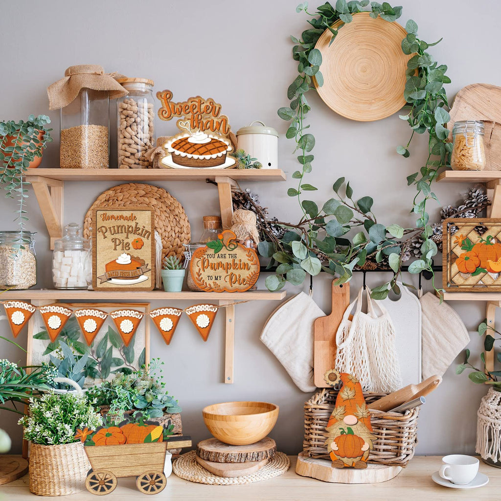 Thanksgiving tiered tray decor set with wooden pie slice signs, pumpkin cart, gnome, and banner on a shelf.