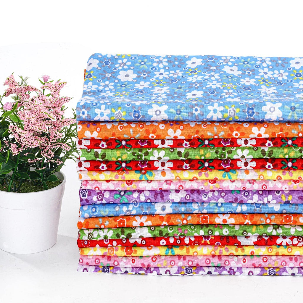 Stack of 15 colorful floral fabric squares with a potted pink plant on the left.