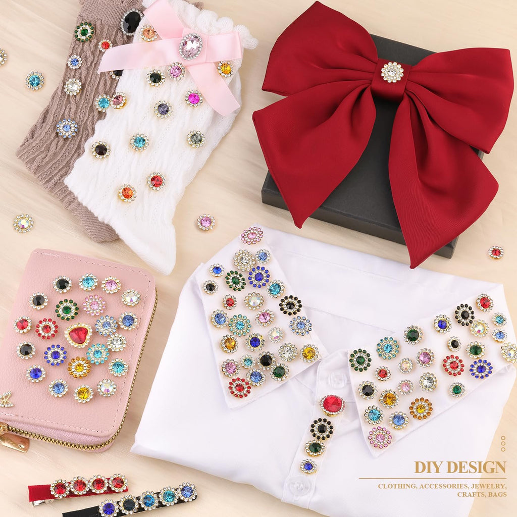 Assortment of colorful sew-on rhinestones displayed on various items like socks, a wallet, a shirt collar, and a large red bow.
