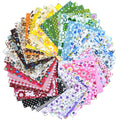 Fan arrangement of 150 pre-cut cotton fabric squares with multicolored abstract floral and polka dot patterns.