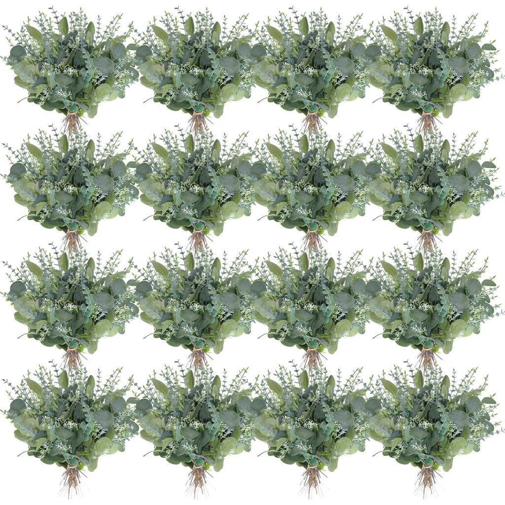 Arrangement of artificial eucalyptus stems with green leaves and white seed branches on a white background.