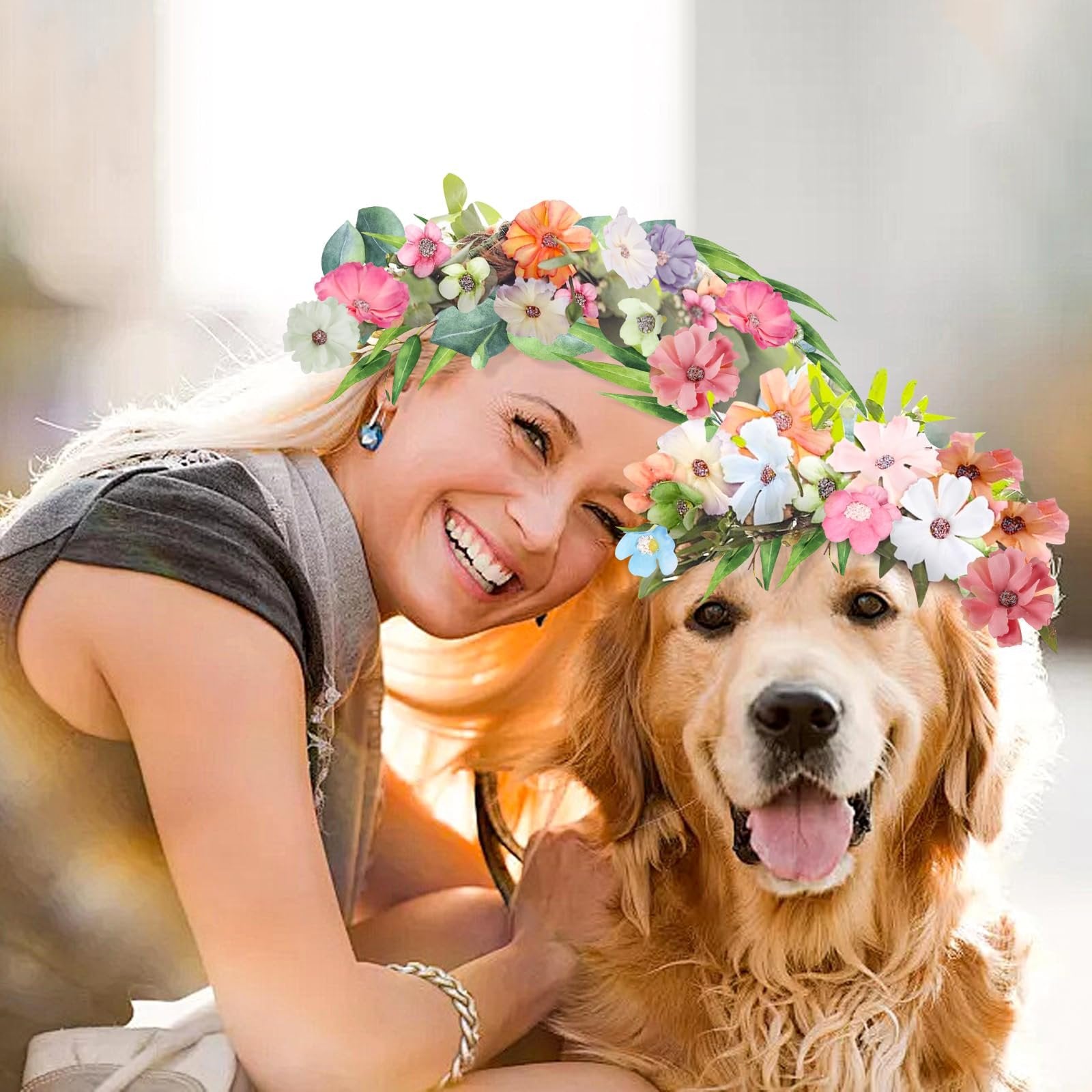Woman and golden retriever dog wearing colorful faux flower crowns outdoors