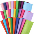 Assortment of colorful tissue paper sheets, some with glitter, fanned out against a white background.