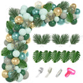 Jungle safari balloon garland kit with metallic green, gold, and gray balloons, artificial palm leaves, and balloon accessories on a white background.