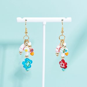Two pairs of handmade millefiori glass bead dangle earrings on a white display stand, featuring colorful flower and bead charms.