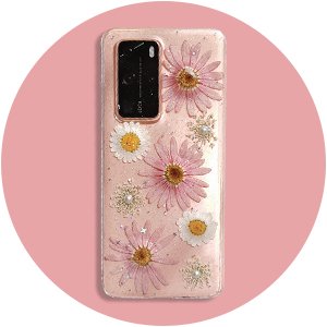 Clear phone case with pink and white dried flowers and glitter embedded, against a pink circle background.