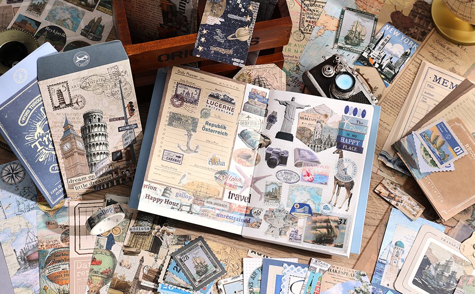 Travel-themed scrapbook kit contents laid out, including a planner, stickers, papers, and washi tape.