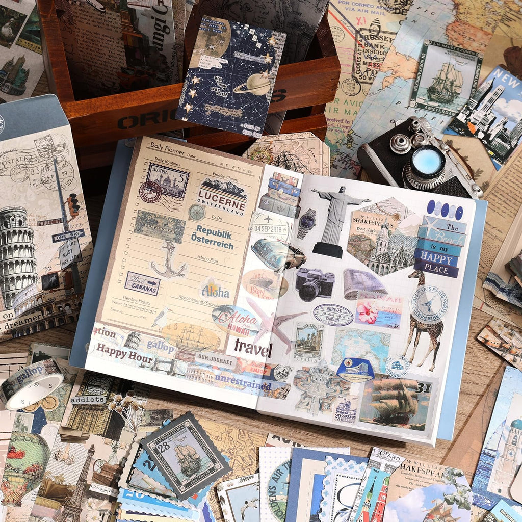 Scrapbooking supplies including stickers, papers, and a planner laid out on a table, featuring travel-themed designs.