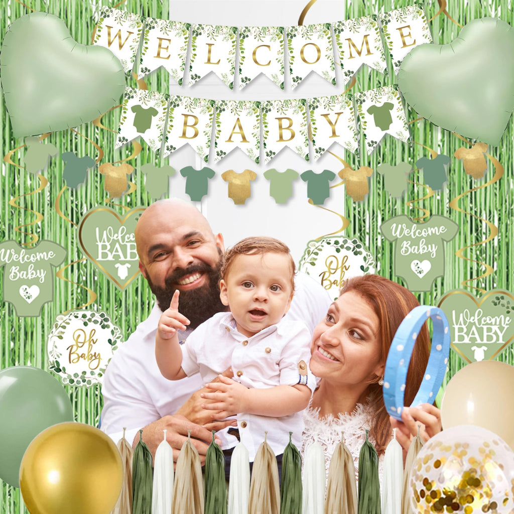 Family celebrating a baby shower with sage green balloons, banners, and decorations.