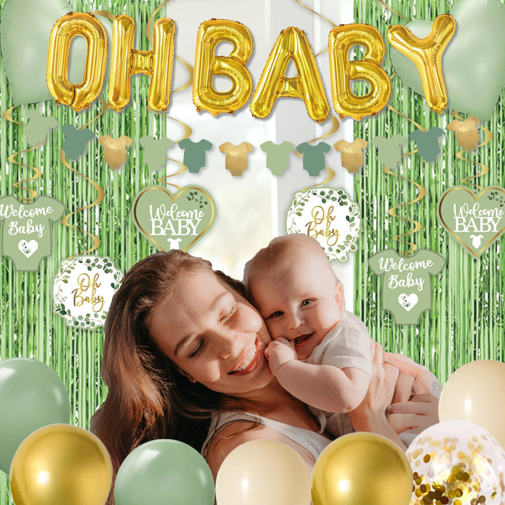 Mother and baby smiling surrounded by sage green and gold balloons and baby shower decorations