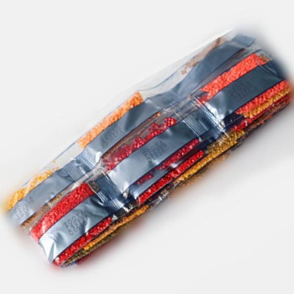 Diamond painting beads in sealed plastic bags, sorted by color, with dark blue labels.