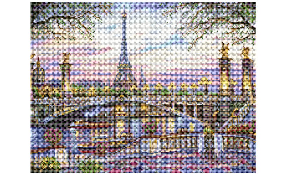 Diamond painting kit showing the Eiffel Tower and Seine River at sunset, with trees framing the top.