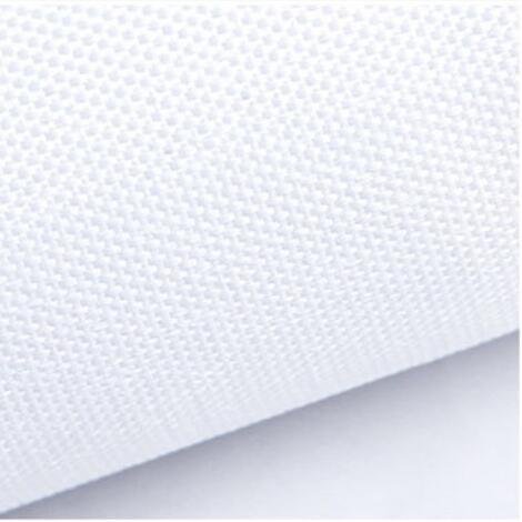 Close-up of white textured fabric with a subtle weave pattern, angled view.