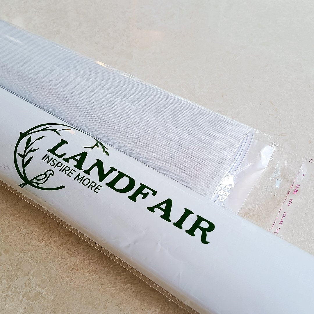 Two rolled diamond painting canvases in plastic packaging, one with a green logo and text.