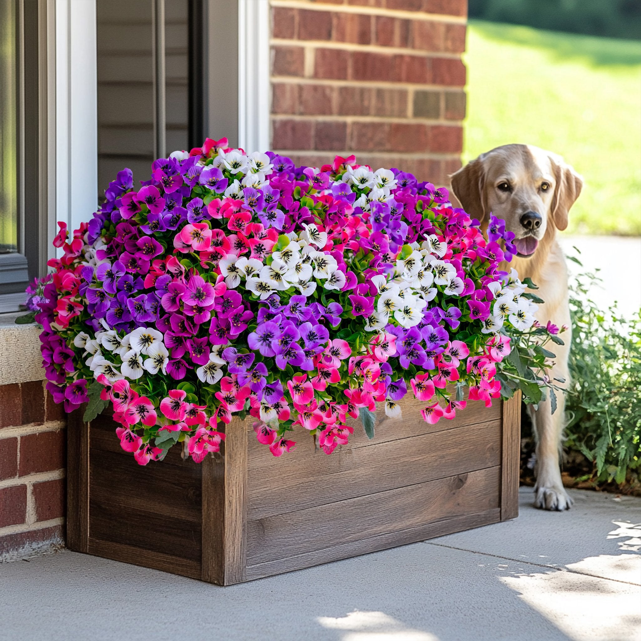 A wooden planter filled with vibrant artificial flowers and greenery, with a golden retriever peeking out from behind it.