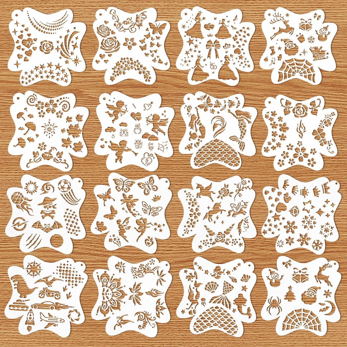 Grid of 16 white face paint stencils with various patterns like butterflies, flowers, mermaids, and holiday themes on a wooden background.