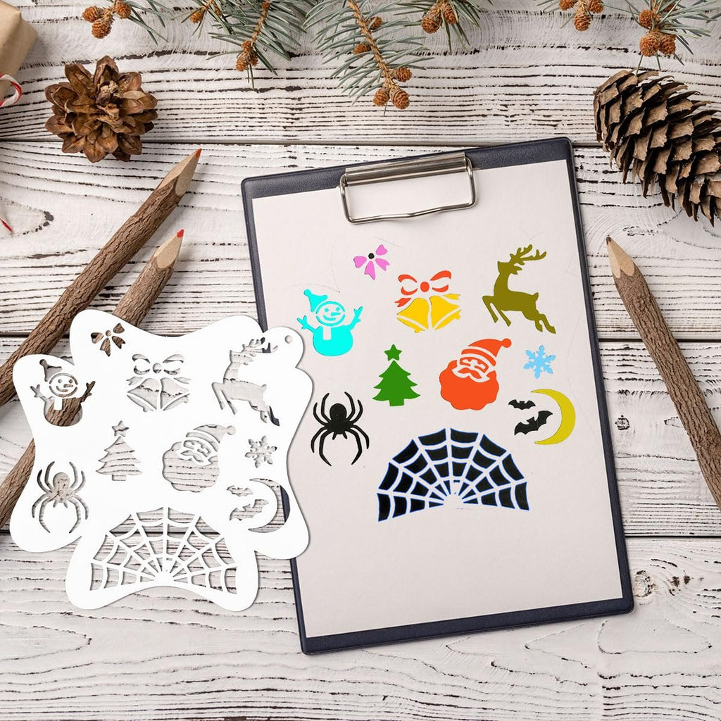 Christmas and Halloween themed stencils on a clipboard with pine cones and branches