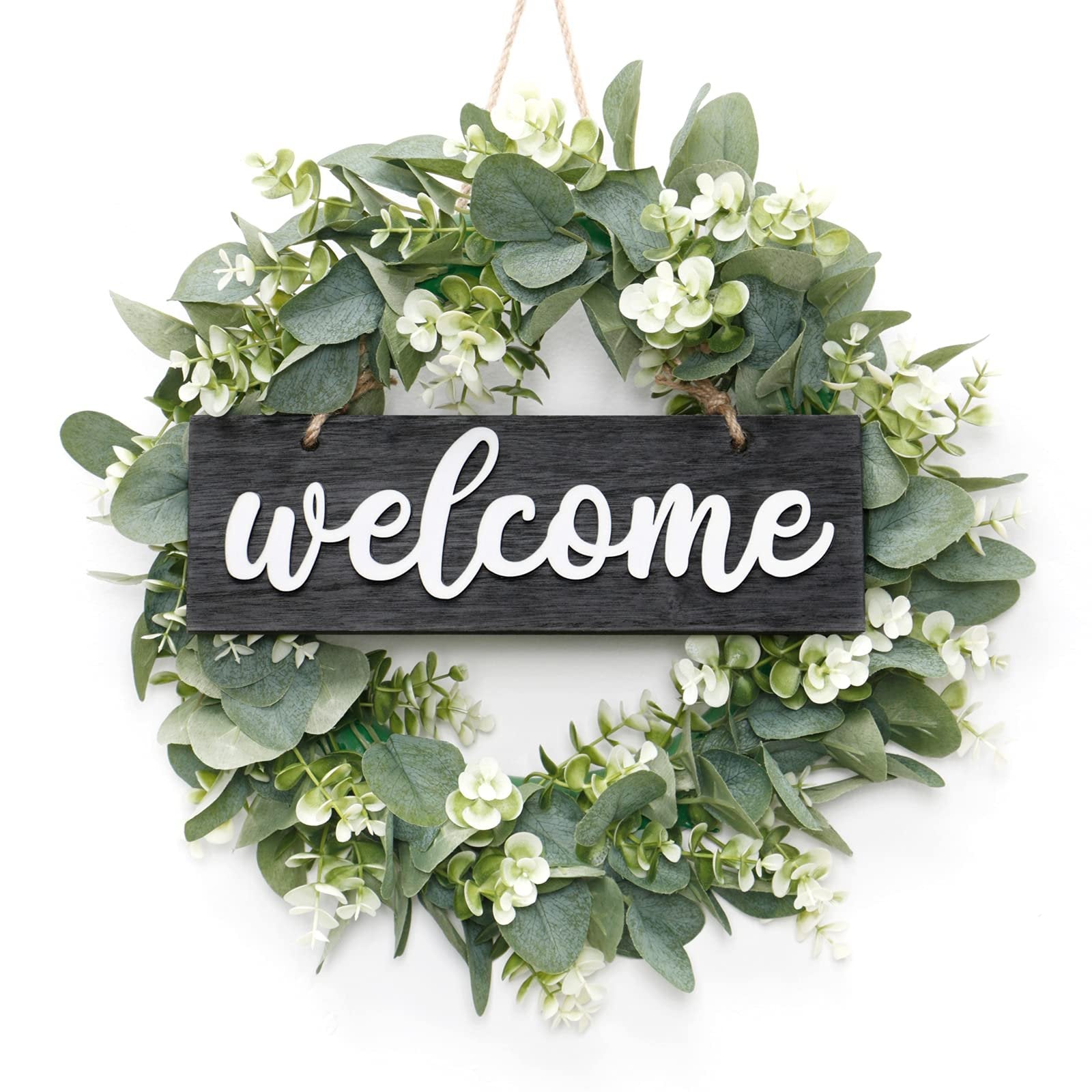 Artificial eucalyptus leaves wreath with white 'welcome' sign hanging on a white background