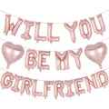 Rose gold foil balloons spelling 'Will You Be My Girlfriend' with two heart balloons, strung on a wire.