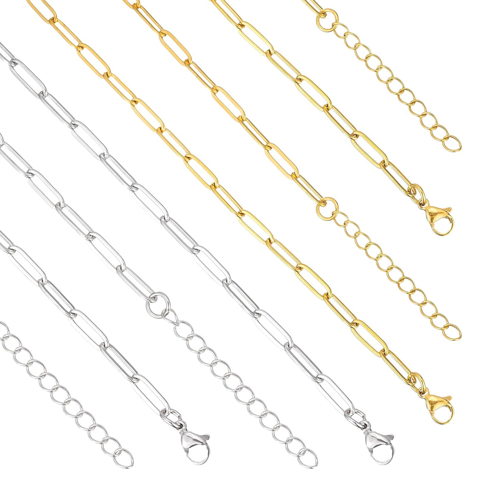 Gold and silver paperclip chains with lobster clasps and extension chains, displayed diagonally on a white background.