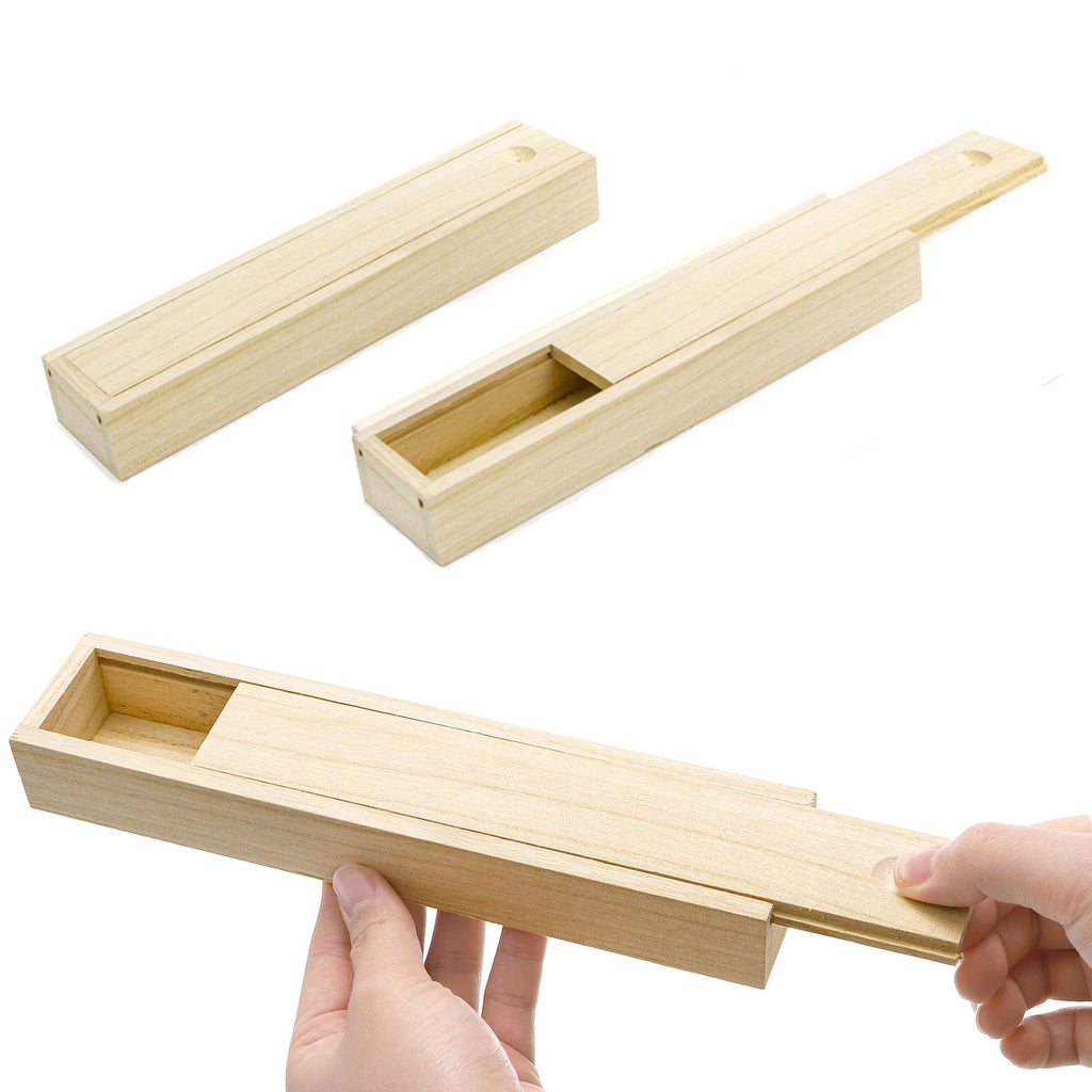 Three unfinished pine wood boxes with sliding lids, one open and one being opened by a hand.