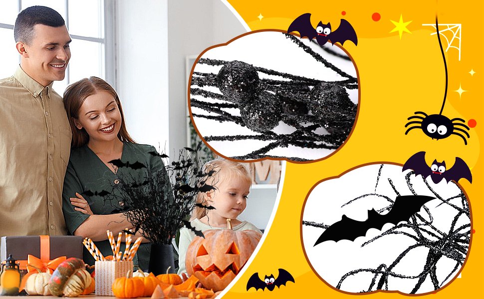 Family and child decorating for Halloween with artificial branches, black bats, and pumpkins.