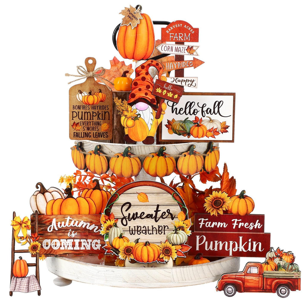 Thanksgiving tiered tray decor with pumpkins, a gnome, and fall-themed signs.
