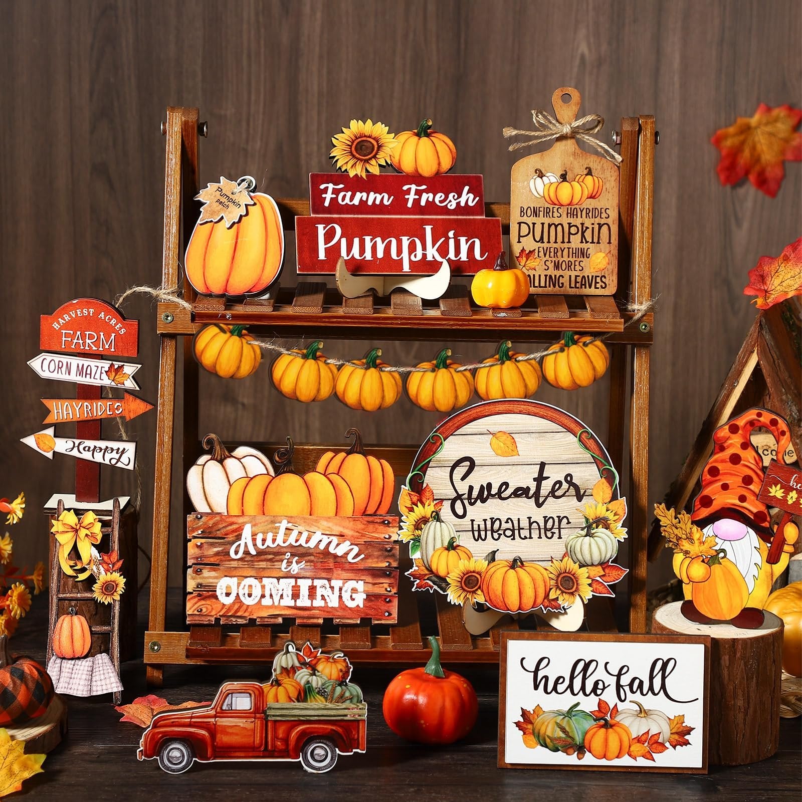 Thanksgiving tiered tray decor set with pumpkins, gnomes, and fall-themed signs arranged on a wooden shelf.
