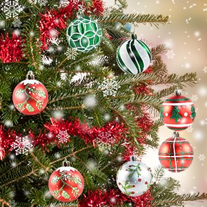 Assortment of shatterproof Christmas ball ornaments in red, white, green, and silver hanging on a decorated pine tree with tinsel and snowflakes.