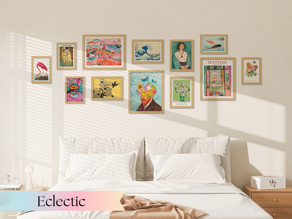Gallery wall of unframed vintage botanical prints above a bed, featuring various art styles and subjects.