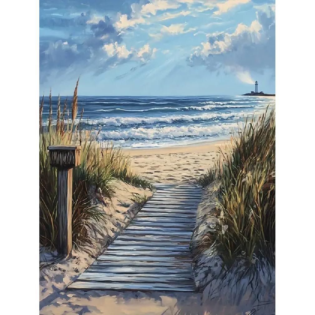 Wooden boardwalk leading to a sandy beach with ocean waves and a distant lighthouse under a cloudy sky.