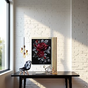 Diamond painting of red roses hanging on a white brick wall above a black desk.