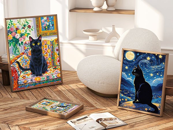 Two framed paint by numbers canvases featuring black cats, one on a colorful sofa and the other under a starry night sky, displayed in a living room setting.
