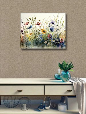 Watercolor painting of wildflowers and grass hanging on a textured wall above a white dresser.
