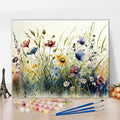 16 x 20 inch wildflower paint by numbers kit with acrylic paints and brushes laid out on a wooden surface.