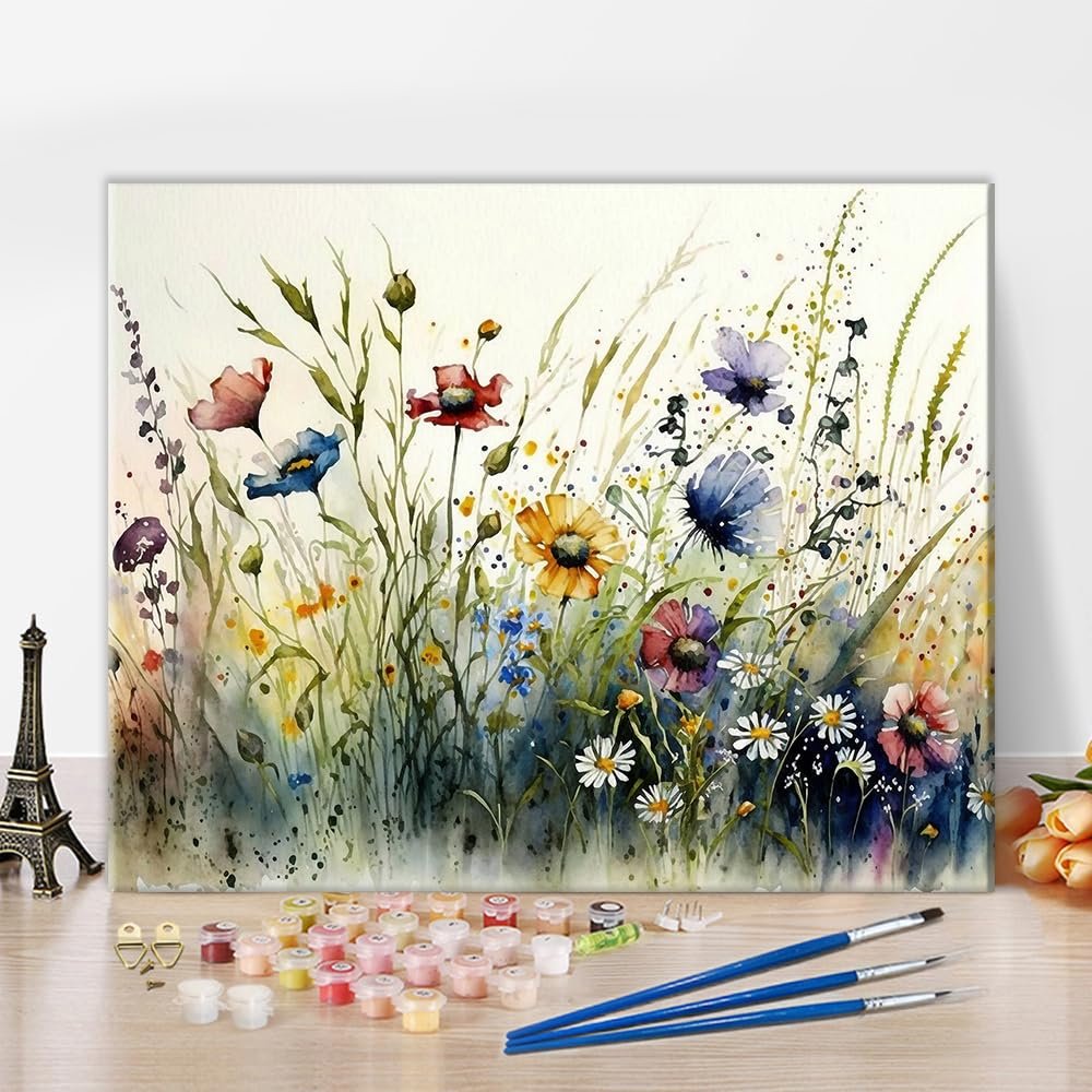 16 x 20 inch wildflower paint by numbers kit with acrylic paints and brushes laid out on a wooden surface.