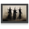 Three dark figures in witch hats and flowing robes holding staffs, depicted in a vintage, smoky style within a decorative frame.