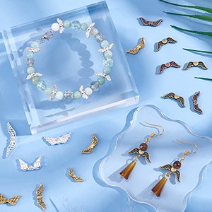 Angel wing metal spacer beads in bright silver alloy and antique bronze, shown with a finished bracelet and earrings.